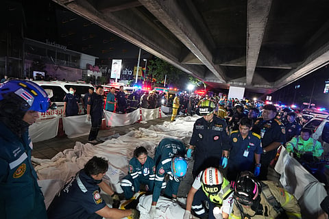 Bodies of victims of a fire are seen laid in a row in Bangkok, Thailand, Monday, July 13, 2026