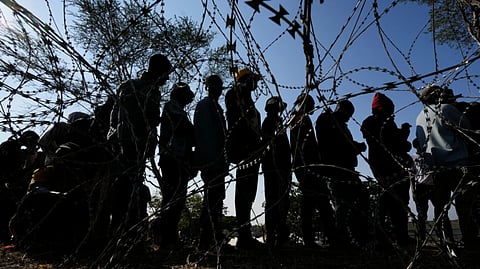 Malawian migrants stand in a queue for their deportation at a temporary centre in Durban, South Africa, Thursday, June 18, 2026.