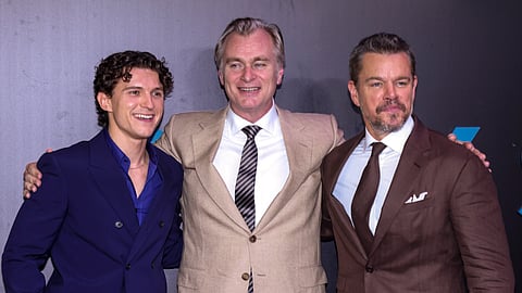 Filmmaker Christopher Nolan, centre, with actors Tom Holland, left, and Matt Damon during the premiere of the film The Odyssey, in Mumbai, Maharashtra, Saturday, July 11, 2026