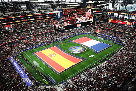 Spanish and French flags are seen on the pitch during the presentation of the teams before the World Cup semifinal soccer match between France and Spain in Arlington, Texas, near Dallas, Tuesday, July 14, 2026.