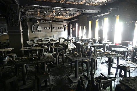 In this handout photo released by Bangkok Metropolitan Administration, the interior of a beer bar is seen after a fire in Bangkok, Thailand, Monday, July 13, 2026.