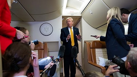US President Donald Trump speaks with reporters in flight on Air Force One after landing at US Air Force Base at RAF Mildenhall, in Suffolk, Eastern England, Wednesday, July 8, 2026.