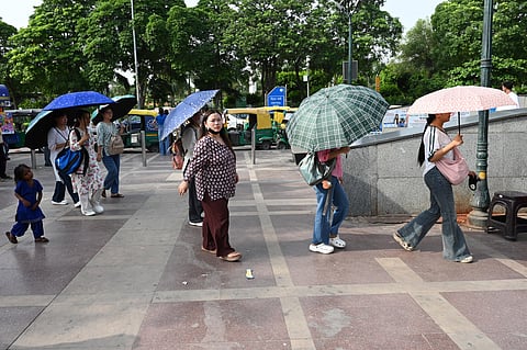 People seen out during a hot day at Connaught Place , on June 13, 2026 in New Delhi.