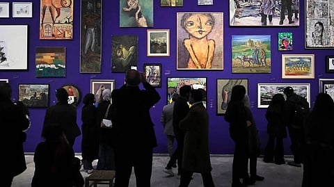 The Palestinian Museum's display features contemporary artworks alongside traditional costumes from war-torn