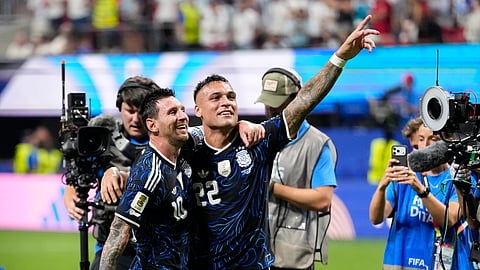 Argentina's Lionel Messi, left, and Lautaro Martinez celebrate at the end of the World Cup semifinal soccer match between England and Argentina in Atlanta, Wednesday, July 15, 2026.