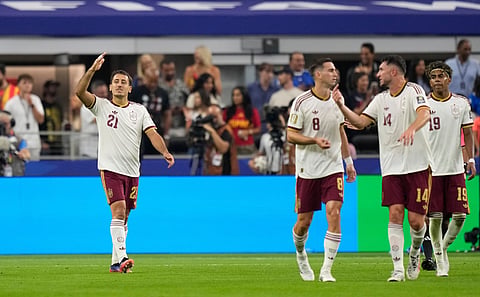 Mikel Oyarzabal (L) celebrates after scoring the opening goal against France on Tuesday