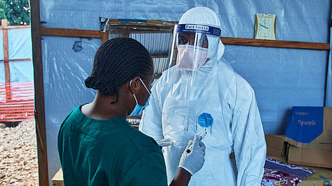 Health workers interact at the Evangelical Medical Center, in Bunia, eastern Congo, Friday, July 3, 2026, where Ebola clinical trials are scheduled to take place.