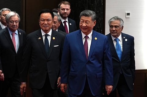 From left, UN Secretary-General AntĂłnio Guterres, Thailand Prime Minister Anutin Charnvirakul, Chinese President Xi Jinping and Pakistan Deputy Prime Minister Mohammad Ishaq Dar arrive for a group photo before the opening ceremony for the World AI Conference in Shanghai, Friday, July 17, 2026.