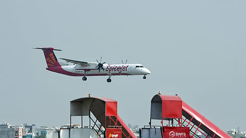A SpiceJet aircraft is seen landing at Indira Gandhi International Airport in New Delhi.