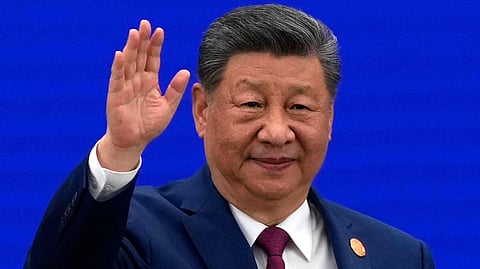 Chinese President Xi Jinping waves as he arrives at the opening ceremony for the World AI Conference in Shanghai, Friday, July 17, 2026.
