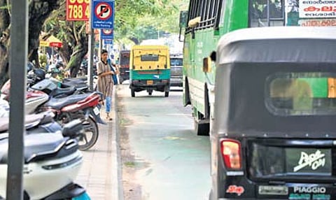Moving vehicles occupy the dedicated cycle lane on Park Avenue near Maharaja’s College on Saturday, defeating the purpose of the facility