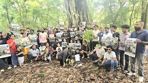 Environmental activists protest against the proposed felling of nearly 3,000 trees for a highway project in Uttarakhand.
