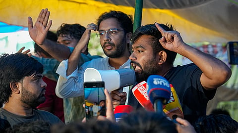 Cockroach Janta Party (CJP) founder Abhijeet Dipke addresses media as Activist Sonam Wangchuk, unseen, who has been on an indefinite hunger strike for 21 days, is shifted to a hospital from Jantar Mantar, in New Delhi, Saturday, July 18, 2026.