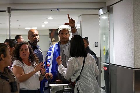 Cuban dissident artist Luis Manuel Otero Alcántara reacts after arriving at Miami International Airport on Saturday, July 18, 2026, after serving a five-year prison sentence in Cuba.