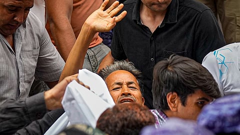 Activist Sonam Wangchuk, who has been on an indefinite hunger strike for 21 days, waves as he is shifted to a hospital from Jantar Mantar, in New Delhi, Saturday, July 18, 2026.
