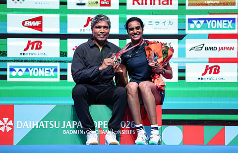PV Sindhu celebrates her victory with coach Irwansyah