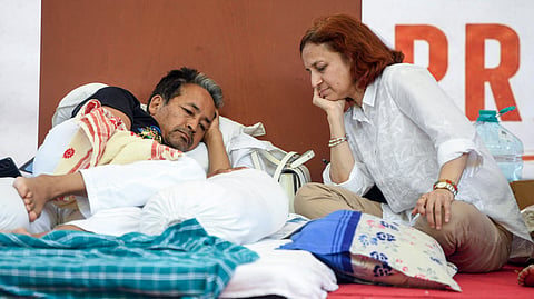 Sonam Wangchuk, with his wife Gitanjali J Angmo, on the 20th day of his indefinite hunger strike as part of the Cockroach Janata Party's (CJP) protest at Jantar Mantar in New Delhi on Friday.