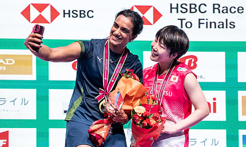 PV Sindhu (L) celebrates her victory with Akane Yamaguchi on Sunday