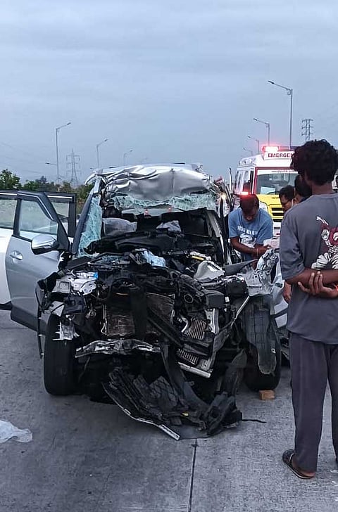 Damaged car at the accident spot on NH-16 near Visakhapatnam where four people were killed and one injured after the car rammed into a lorry.