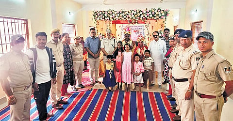 The newlywed under-trial prisoners with prison officials and others.