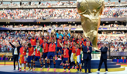 Spain players lift the trophy after the final on Sunday
