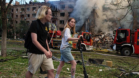 Destroyed cars sit after a Russian attack at the market in the Lukianivka neighbourhood of Kyiv, Ukraine, Thursday, June 11, 2026.
