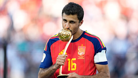 Spain's Rodri poses with the tournament's best player award at the end of the World Cup final soccer match between Spain and Argentina in East Rutherford, N.J., near New York, Sunday, July 19, 2026.