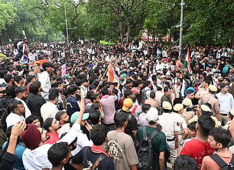 Cockroach Janata Party (CJP) supporters raise slogans as they gather ahead of a protest march, at the Jantar Mantar, in New Delhi, early Monday, July 20, 2026.