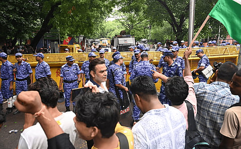 Cockroach Janata Party founder Abhijeet Dipke continues his sit-in protest demanding the resignation of Union Education Minister Dharmendra Pradhan over alleged irregularities in the NEET examination, in New Delhi, Tuesday, July 21, 2026