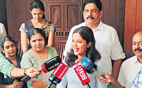 Diya Binu Pulikkakandam with her father and councillor Binu Pulikkakandam at their residence in Pala after she was voted out as Pala municipal chairperson through no-confidence motion on Tuesday