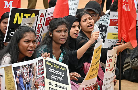 Students under the banner of All India Democratic Students’ Organisation protest the police action on students in Delhi at Freedom Park in Bengaluru on Tuesday.
