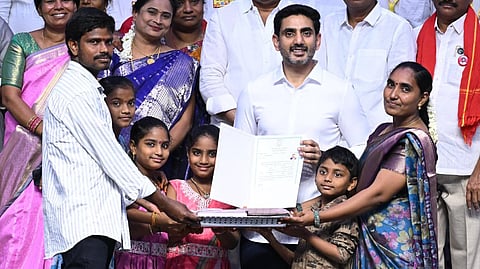 HRD and IT Minister Nara Lokesh during the Mana Illu - Mana Lokesh programme where he handed over house site pattas to beneficiaries in Mangalagiri.