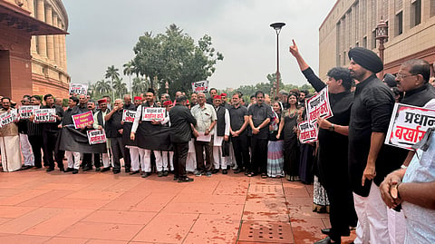 Opposition MPs stage protest against government outside the Parliament.