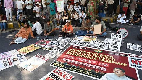 Protests calling for Education minister Dharmendra Pradhan's resgination in New Delhi.