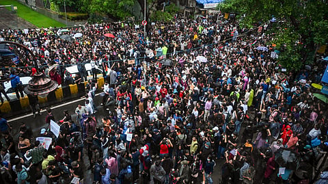 Protestors gather in support of Cockroach Janta Party and demand Union Education Minister Dharmendra Pradhan's resignation, near Shivaji Park in Mumbai, Wednesday, July 22, 2026.