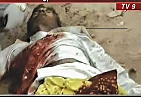 A victim of the serial blasts lies on the street in Ahmedabad