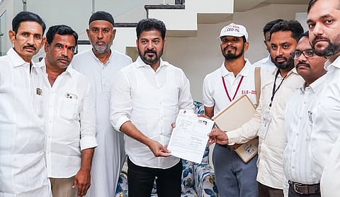As the Special Intensive Revision (SIR) of electoral rolls continues across the state, Chief Minister A Revanth Reddy fills his SIR form and submits it to the Booth Level Officers (BLOs) in Kodangal