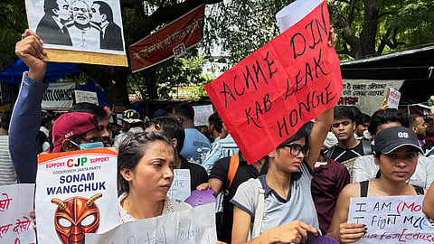 Protestors carry placards during a demonstration demanding educational reforms as part of the Cockroach Janta Party's ongoing protest movement in New Delhi, India, Thursday, July 23, 2026.