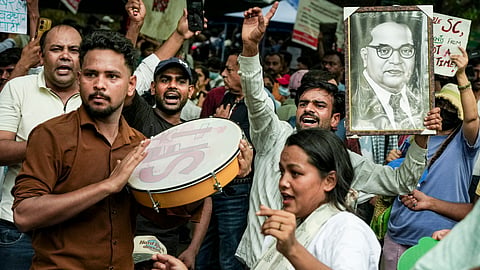 Protesters raise slogans during the ongoing protest over the alleged NEET-UG examination irregularities at Jantar Mantar, in New Delhi, Thursday, July 23, 2026.