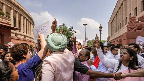 Opposition and ruling party MPs clash during their protests amid the ongoing Monsoon session of Parliament in New Delhi, Thursday, July 23, 2026.