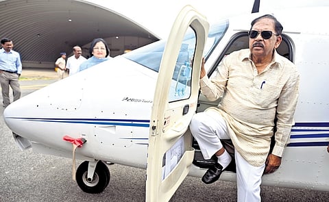 Deputy Chief Minister Dr G Parameshwara inspects an aircraft at the Government Flying Training School at Jakkur in Bengaluru on Friday.