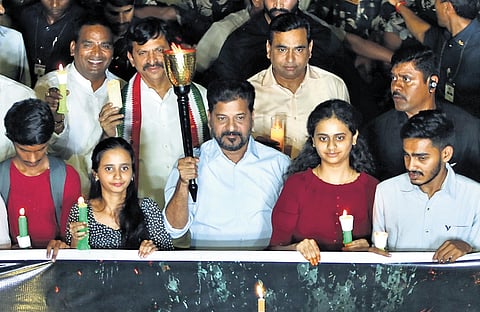 Chief Minister A Revanth Reddy leads candlelight march from People’s Plaza to the Indira Gandhi statue in Hyderabad on Saturday