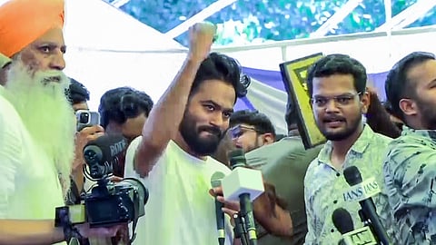 Cockroach Janta Party (CJP) founder Abhijeet Dipke speaks to the media after Union Education Minister Dharmendra Pradhan's resignation in New Delhi on Saturday, July 25, 2026.