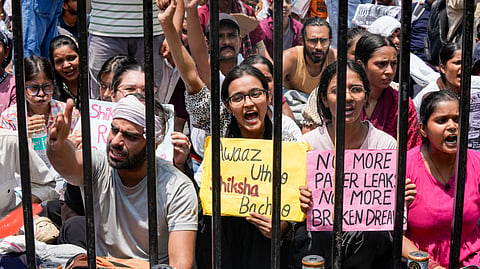 Cockroach Janta Party (CJP) supporters during a protest demanding the resignation of Union Education Minister Dharmendra Pradhan over alleged irregularities in the NEET examination, in New Delhi, Wednesday, July 22, 2026.