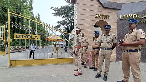 Police personnel stand guards near Loyola college as students protested inside the college premises in support of Delhi neet Protest in Chennai.