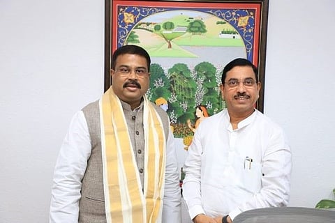 A file pic of Dharmendra Pradhan (L) with new education minister Pralhad Joshi