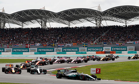 Mercedes driver Lewis Hamilton of Britain leads the field into turn three at the start of the Malaysian Formula One Grand Prix.