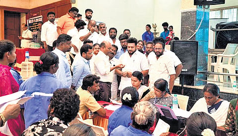 Mohammed Ibrahim, elder brother of Labour Welfare Minister J Mohammed Parvez, interacts with Pudukkottai Commissioner M Gandhiraj during a government welfare camp for sanitation workers on July 22.