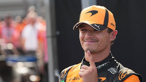 McLaren driver Lando Norris of Britain celebrates after winning the qualifying session ahead of Sunday's Formula One Hungarian Grand Prix on Saturday, July 25, 2026.