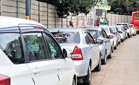 Cars parked on Sheshadri Road causing inconvenience to commuters